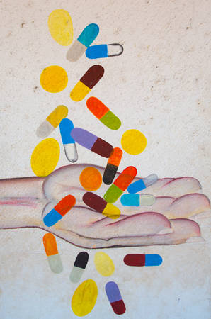 White wall background. Illustration of a male hand catches falling pills.