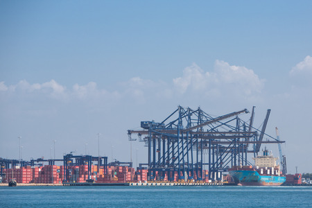 CARTAGENA, COLOMBIA, JANUARY 9: Cranes, containers and a ship at the Cartagena port on the Northern...