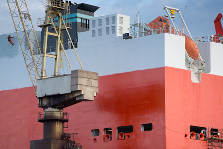 shipyard worker painting a ship under construction on drydock in Gdansk Shipyard.の写真素材