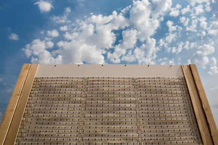 Computer transistors glued together on a wood board with a blue sky in the backgroundの写真素材