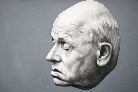 BERLIN - AUGUST 08: Famous graffiti of academician Andrei Sakharov on Berlin Wall at East Side Gallery August 08, 2009 in Berlinのeditorial素材