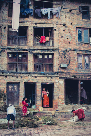 BHAKTAPUR, NEPAL, APRIL 24: unidentified group of people working in the old city of Bhaktapur on the 24 april 2013, Nepal. The Nepalese lfestyle is still based on the agriculture.のeditorial素材