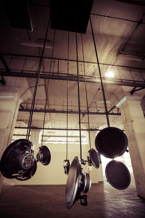GDANSK, POLAND, SEPTEMBER 18: Detail of hanging speakers. Art installation in an industrial site in Gdansk on September 18, 2013. Poland.のeditorial素材