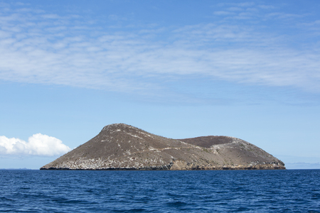 Blue Pacific Ocean and Inhabited island with clear blue sky. Galapagos Islands. Ecuador 2015の写真素材