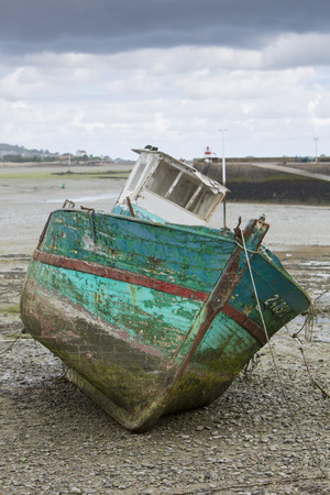 Old wooden shipwreck on a beach in Paimpol. Brittany, Franceの写真素材