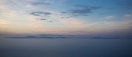 Blue horizon and mystical view on the Dolomites chain of Mountains in the north of Italy