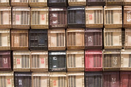 Colourful boxes plastic crates. Packing containers piles for fish storage of catch. Morocco