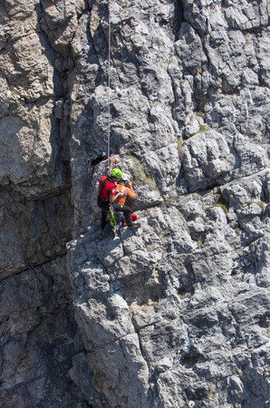 CORTINA D'AMPEZZO, ITALY, June 08: Mountain rescue team members in action in the mountains of Dolomites also known as the Soccorso Alpino - June 8th 2014 in Italy.のeditorial素材