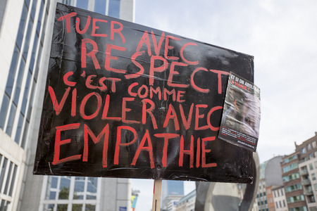 BRUSSELS, BELGIUM, SEPTEMBER 28: Belgian Gaia activists protest on the streets of Brussels on September 28, 2014 against slaughter without stunning. Support of people to petition for stunning animals before slaughter so they are unconscious before being kのeditorial素材