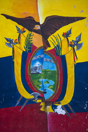 OTAVALO, ECUADOR - FEB 28, 2015: Graffiti on wall, composition of Ecuador flag and American Bald Eagle with the Imbabura volcano. Ecuador 2015.のeditorial素材