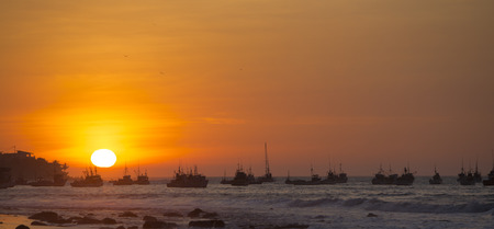 Panorama of the harbor of Manora during a wonderful orange sunset. Peru 2015の写真素材