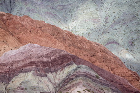 Cerro del los Siete Colores (Hill of Seven Colors) over Purmamarca village (Quebrada de Humahuaca valley), Argentinaの写真素材