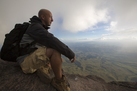 MOUNT RORAIMA, VENEZUELA, APRIL 03: Hiker looking at the landscape from the top of Mount Roraima Tepuy, Gran Sabana. のeditorial素材