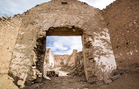 Abandoned and decaying church in San Antonio ghost village at the footstep of San Antonio volcano in the Bolivian altiplano.の写真素材