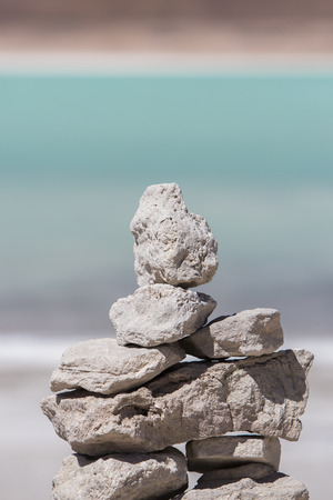Laguna Verde with blue sky and pile of stones. Salt lake at the foot of the volcanos Licancabur and Juriques - Eduardo Avaroa Andean Fauna National Reserve, Bolivia. Border with Chileの写真素材