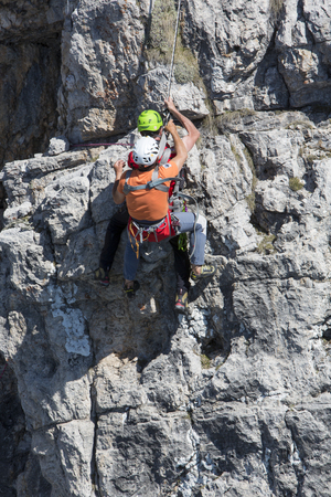 CORTINA D'AMPEZZO, ITALY, June 08: Mountain rescue team members in action in the mountains of Dolomites also known as the Soccorso Alpino - June 8th 2014 in Italy.のeditorial素材