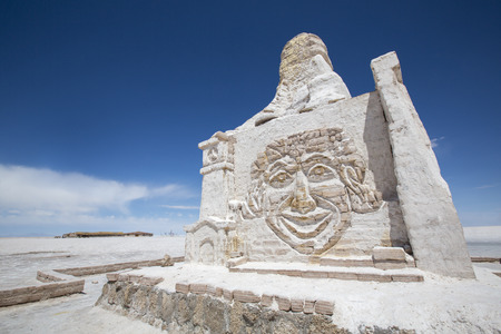 SALAR DE UYUNI, BOLIVIA, JANUARY 2: Unidentified man standing on top of the Paris Dakar huge salt sculpture. This monument is dedicated to the rally Paris-Dakar, going through the Salar every year. 2015のeditorial素材