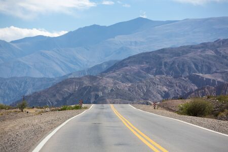 The famous Route 40 paved road parallel to the Andes against a blue sky and going towards the Salinas Grande, Jujuy Province. Argentina 2014の写真素材