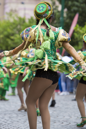 SALTA, ARGENTINA, DEC 18: Young women performers dancing and celebrating the opening of the carnival of Salta in the street with colorful costumes. North of Argentina 2014のeditorial素材