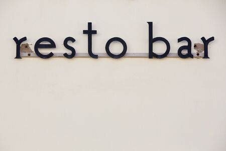 Old letter bar restaurant sign haging on a on wall in the old colonial city of Cachi on the Ruta 40 (route 40) within the Calchaqui Valleys in Salta Province. Argentinaのeditorial素材