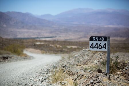 Distance Sign road on gravel road on the famous Ruta 40 Route 40 Within Calchaqui Valleys in Salta Province. Argentinaの写真素材
