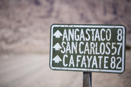 Distance Sign road on gravel road on the famous Ruta 40 (Route 40) within Calchaqui Valleys in Salta Province. Argentinaの写真素材