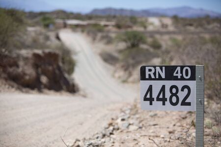 Distance Sign road on gravel road on the famous Ruta 40 (Route 40) within Calchaqui Valleys in Salta...