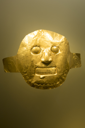 Golden mask on neutral color background, Colombiaの写真素材