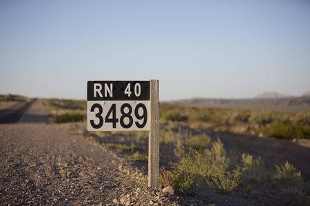 Distance Sign road on paved road on the famous Ruta 40 (Route 40) near the town of San Juan....