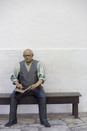 Sculpture of Sarmiento sitting on a bench and ready to book at the Casa Natal de Sarmiento Museum. San Juan. Argentina 2014のeditorial素材