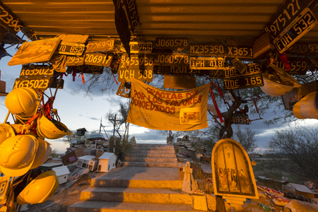 VALECITO, ARGENTINA, DEC 15: The Deceased Correa in Spanish Difunta Correa pilgrimage landmark in San Juan Province, with many offerings and registration plates from all over the world. Argentina 2014のeditorial素材