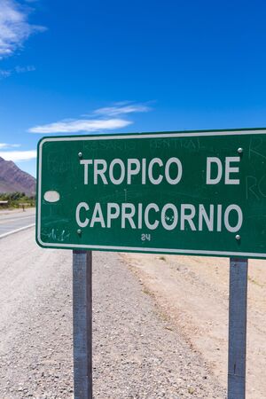 HUMAHUACA, ARGENTINA, DEC 22: Closeup of Tropic of Capricorn sign with personal signatures and names on the colorful valley of Quebrada de Humahuaca in Jujuy Province against a blue sky, Salta Province. Argentina 2014のeditorial素材