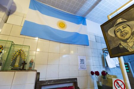 Interior of vintage painting of butchery with Carlos Gardel Tango Famous Singer and a flag from Argentina. Buenos Aires 2014のeditorial素材