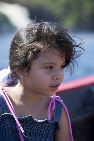 Portrait of beautiful young girl looking right Venezuelan side with nature background. Venezuela 2015のeditorial素材
