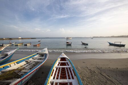 Colorful wooden fisher boats anchored in the bay of Pampatar with loads on the wooden pier. Margarita Island. Venezuelaのeditorial素材