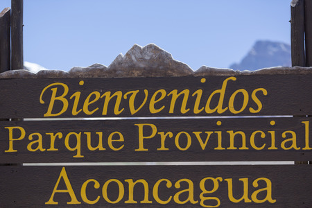 Welcome wooden sign at the Aconcagua National Park with clear blue sky, Andes Mountains, Argentinaのeditorial素材