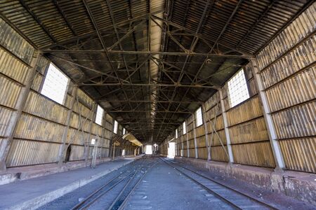 Inside old abandoned train station and railroad tracks along ruta 7 in the Andean Mountains at the...