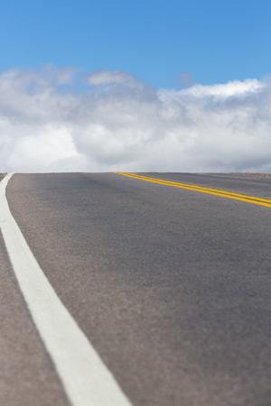 The famous Route 40 paved road parallel to the Andes and clouds in blue sky in Jujuy Province, northern Argentina.の写真素材
