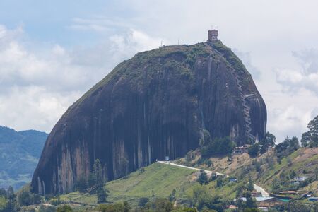 Panorama of the lakes and islands in Guatape with the Piedra el Penol with blue cloudy sky, near Medellin, Colombia.の写真素材