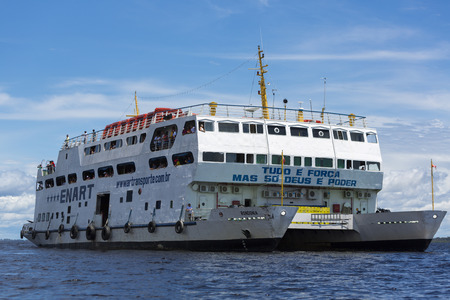 Modern white boat sailing on Amazon Rio Negro near Manaus with passengers, Amazonas State. Brazil 2015のeditorial素材