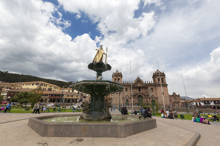 Cusco Main Square Plaza de Armas with the Inca Statue in front of the Iglesia de la Compania with tourists in Cusco, Peru 2015のeditorial素材
