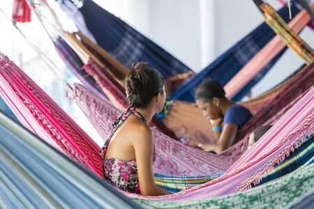 People resting in hammocks passenger boat deck is going down the Amazon river entre LeticiaTabatinga and Manaus. Amazonas State. Brazil 2015のeditorial素材