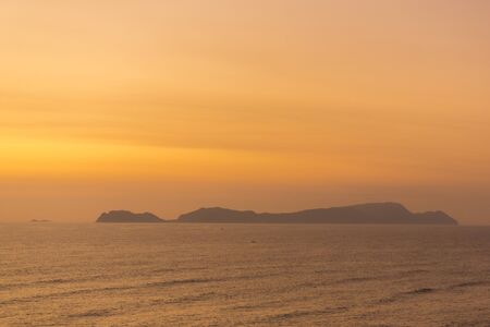 Colored sunset over the Pacific Ocean seen from Lima, Peruの写真素材