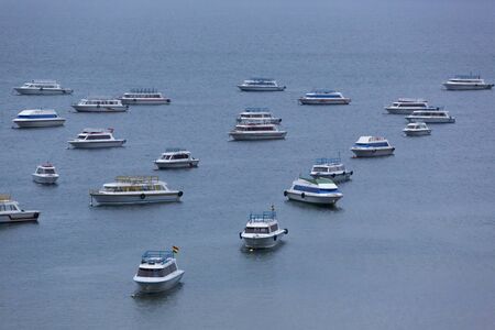 Aerial view of tourist boats anchored in the bay of Copacabana on lake Titicaca early in the morning. Bolivia 2015のeditorial素材