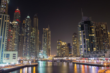Dubai Marina district night scene, modern buildings, bright glowing road lights, luxurious travel and tourism in the United Arab Emirates in 2016のeditorial素材