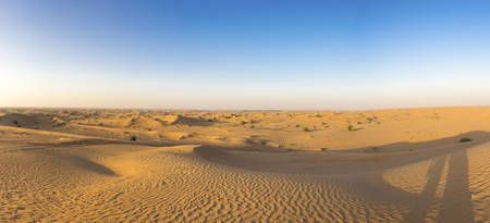 Panorama of the sand dunes desert near by Dubai with a clear blue sky. United Arab Emiratesの写真素材