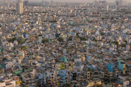 Ho Chi Minh City skyline aerial view with small colored residential houses, medium class district of the capital of Vietnamのeditorial素材