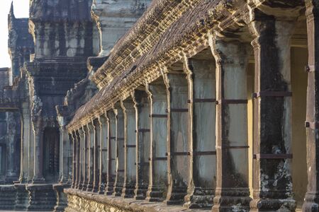 Details of antique architecture at Angkor Wat temple with morning light, Siem Reap province.