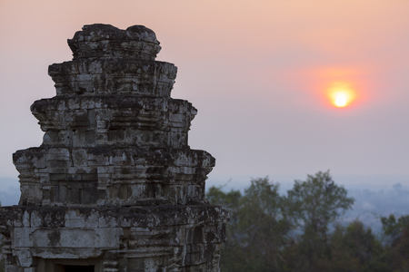 Sunset at Phnom Bakheng temple. Hindu temple in the form of a temple mountain and part of Angkor Complex temples.の写真素材
