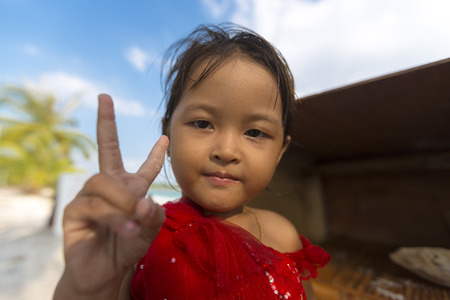 Cute young Cambodian girl saying hello on Koh Rong Island near Sihanoukville, Cambodia. South East Asiaのeditorial素材